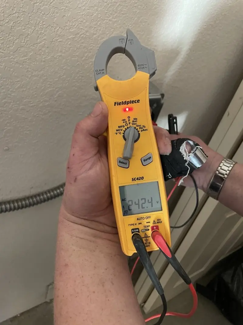 Voltage testing with clamp meter during Ceiling Fan Installation in David City